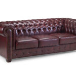 Elegant Chesterfield 3 seater sofa in oxblood red leather – front-facing view showcasing tufted design.