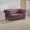 Side view of Chesterfield 2 seater sofa showcasing scroll arms and stud detailing